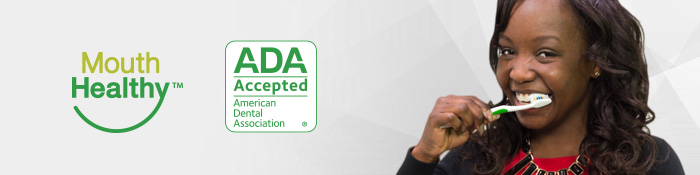 Mouth Healthy - ADA Accepted Woman brushing her teeth. Mouth Healthy - ADA Accepted